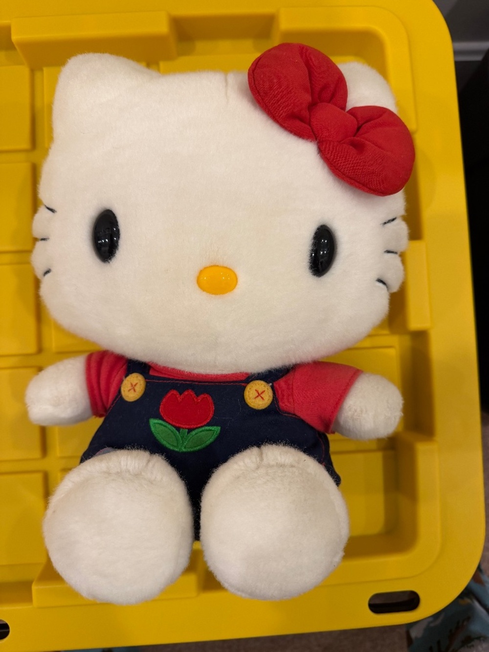 Hello Kitty Plush with blue overalls and tulip